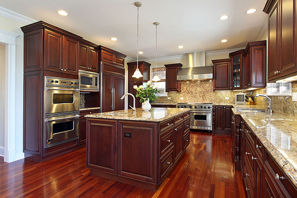 kitchen with wood floor and brown cabinets