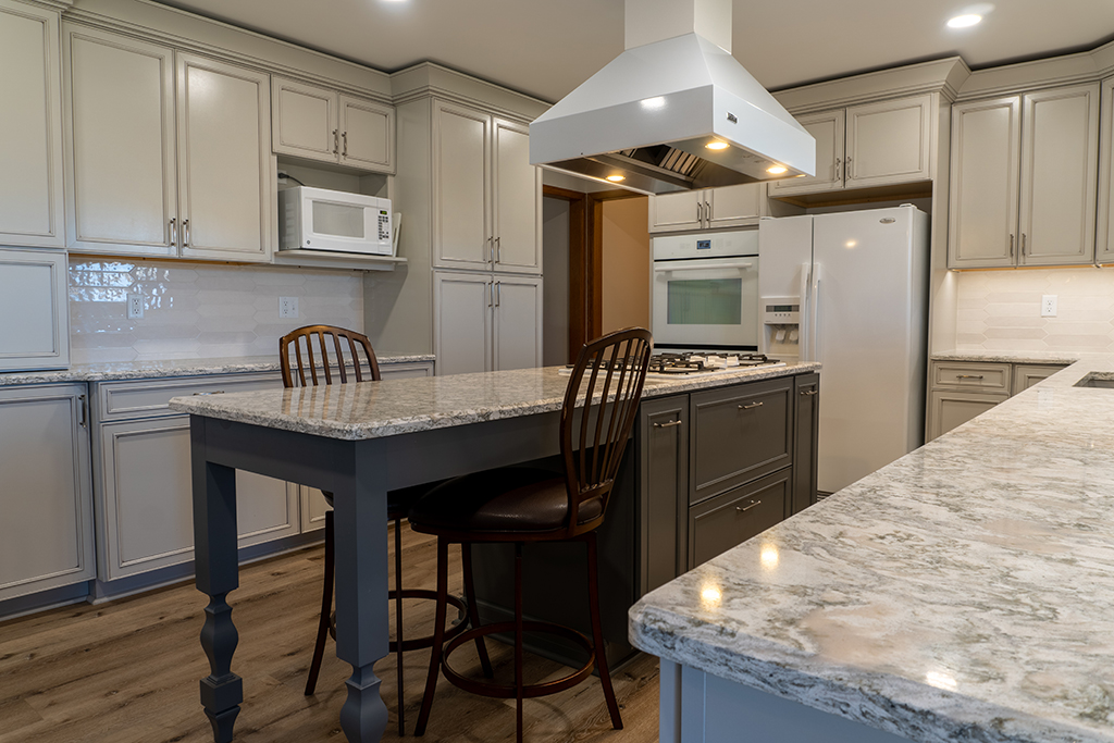 white marble kitchen with dining island