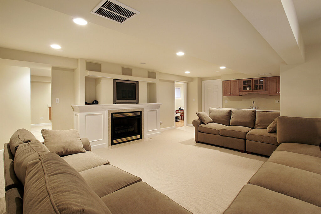 white basement with tan furniture