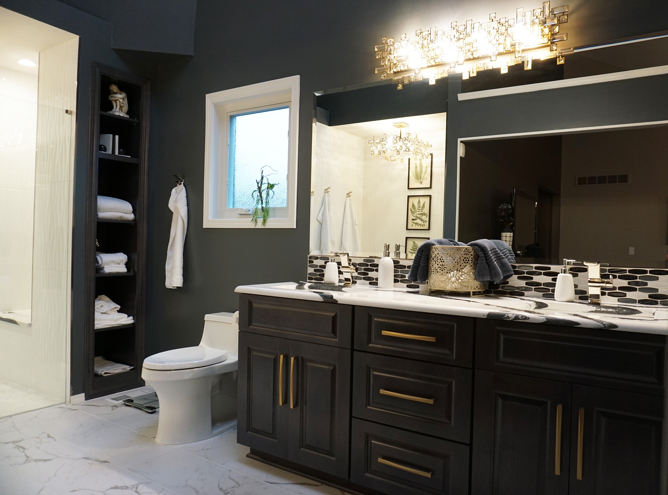 black bathroom with white floor and counters