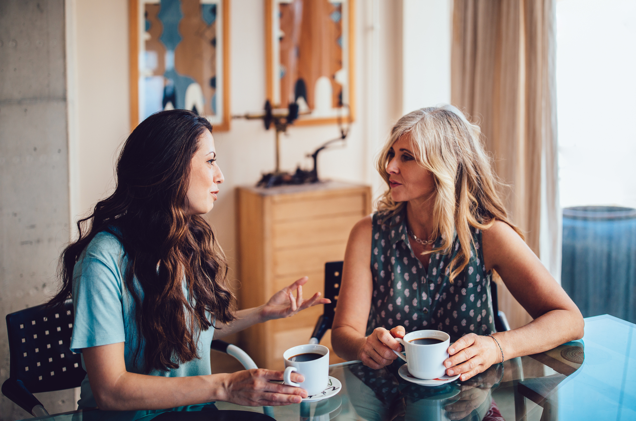 Strategic Remodel Referral - Women talking over coffee